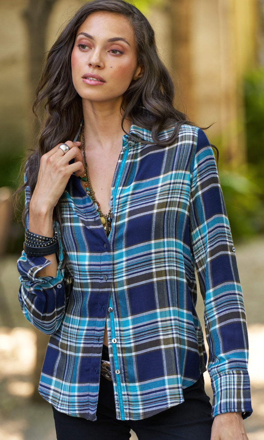 A model wears a CINO Indigo/Olive plaid button-down Shirt